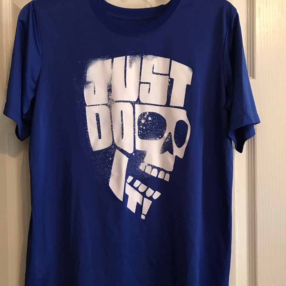 Nike runs small more like fitted T shirt